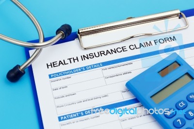 Health Insurance Claim Form With Calculator Stock Photo