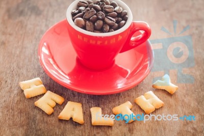 Healthy Alphabet Biscuit With Red Coffee Cup Stock Photo