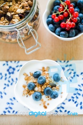 Healthy Breakfast With Granola, Yogurt And Fresh Fruits Stock Photo
