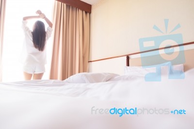 Healthy Woman Stretching In Bed Room And Open The Curtains After… Stock Photo
