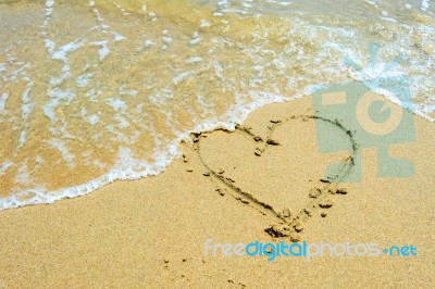 Heart In The Sand On The Beach Stock Photo