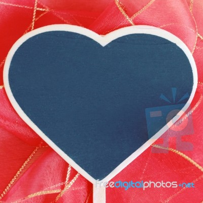 Heart Shaped Blackboard On Red Bow Stock Photo