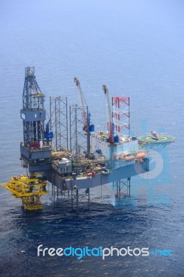 Helicopter Pick Up Passenger On The Offshore Oil Rig Stock Photo