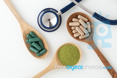 Herbal Medicine In Capsules With Stethoscope Stock Photo