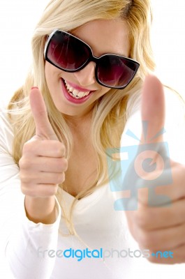 High Angle View Of Glad Female Model With Thumbs Up Stock Photo