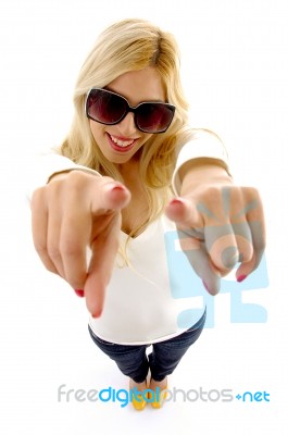 High Angle View Of Smiling Female Model With Pointing Fingers Stock Photo