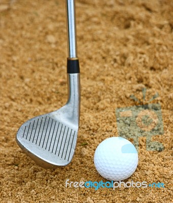 Hitting A Golf Ball Out Of A Bunker Stock Photo