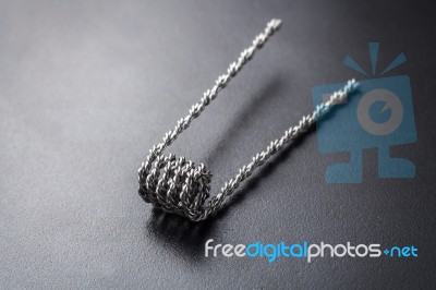 Hive Coil For Vaping On A Black Background Stock Photo