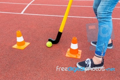 Hockey Player With Stick Ball And Pawns Stock Photo