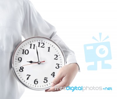 Holding A Clock Stock Photo