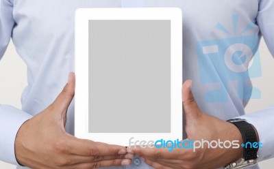 Holding A Digital Tablet Stock Photo