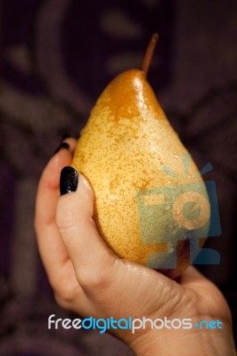 Holding A Pear Stock Photo