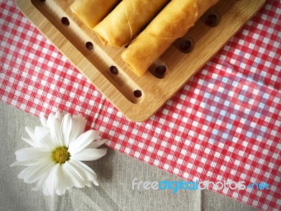 Homemade Deep Frying Spring Rolls With White Daisy Stock Photo