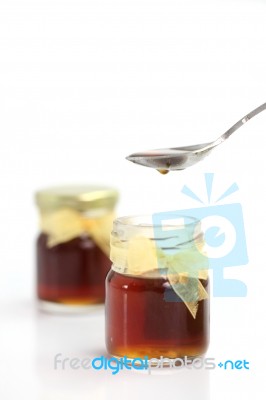 Honey Dripping From Spoon Stock Photo