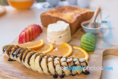 Honey Toast And Ice Cream With Mixed Fruit On Bread Stock Photo
