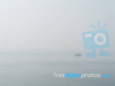 Horizontal Sparse Pale Lonely Ship In White Ocean Background Bac… Stock Photo