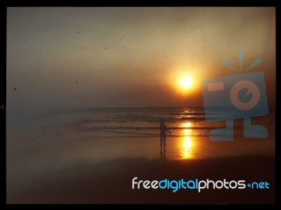 Horizontal Vintage Indian Boy Meeting Sunset On The Beach Postca… Stock Photo