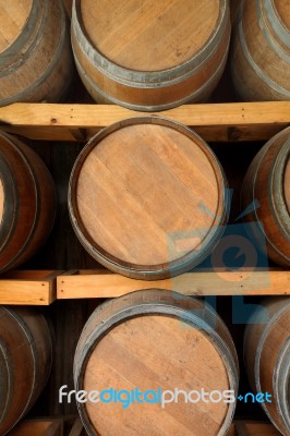 Horizontal Wooden Wine Barrels In Cellar Shelf Stock Photo