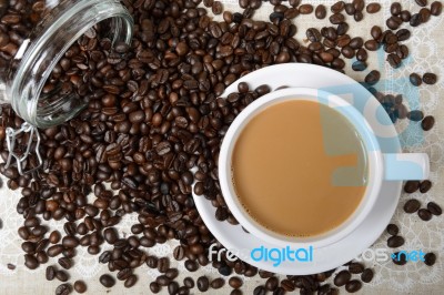 Hot Coffee Cup And Beans Stock Photo