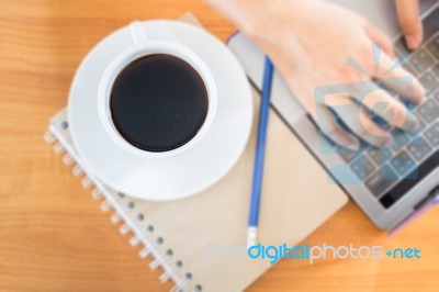 Hot Cup Of Coffee On Working Table Stock Photo
