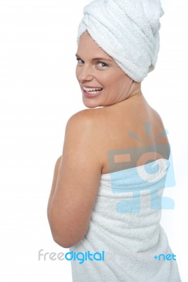 Hot Woman In Bath Towel Turning Back Towards Camera Stock Photo