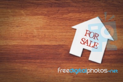 House For Sale Symbol With Wood Background Stock Photo