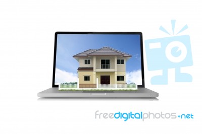 House On Laptop  Stock Photo