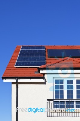 House Roof Covered With Solar Panel Stock Photo