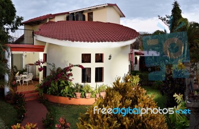 House With Balcony And Garden Stock Photo