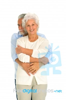 Hugging Elder Couple Stock Photo