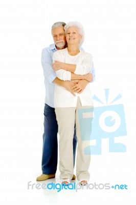 Hugging Elder Couple Stock Photo