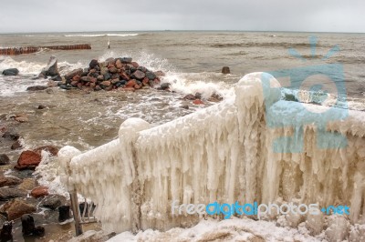 Ice Covered Staircase On The Beach Stock Photo