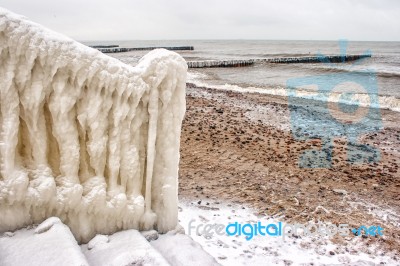 Ice Covered Staircase On The Beach Stock Photo