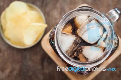 Iced Cola With Potato Chips Stock Photo