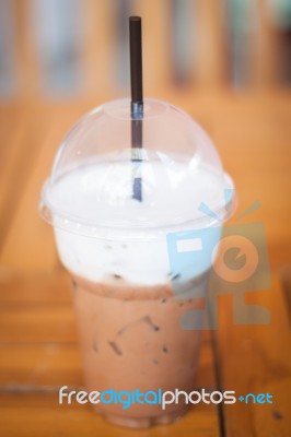 Iced Mocha Coffee In Glass On The Table Stock Photo