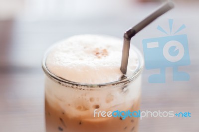 Iced Mocha Coffee In Glass On The Table Stock Photo