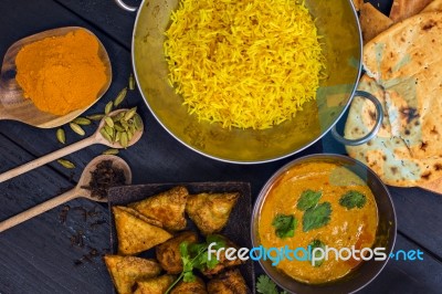 Indian Pilau Rice In Balti Dish Served With Chicken Tikka Masala… Stock Photo