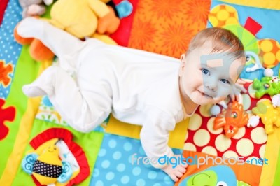 Infant Boy On Playmat Stock Photo