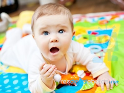 Infant Boy On Playmat Stock Photo