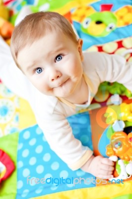 Infant Boy On Playmat Stock Photo