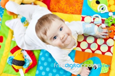 Infant Boy On Playmat Stock Photo