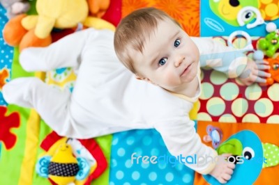 Infant Boy On Playmat Stock Photo