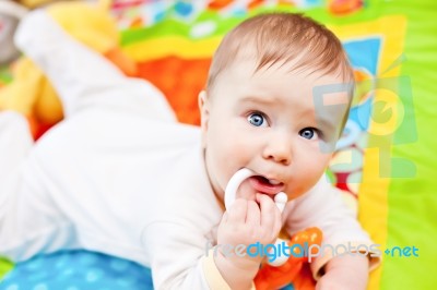 Infant Boy On Playmat Stock Photo