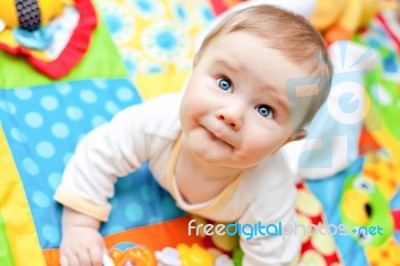 Infant Boy On Playmat Stock Photo