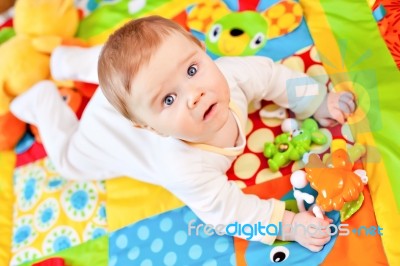 Infant Boy On Playmat Stock Photo