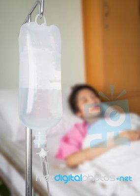 Infusion Bottle With Saline Solution For Patient Stock Photo