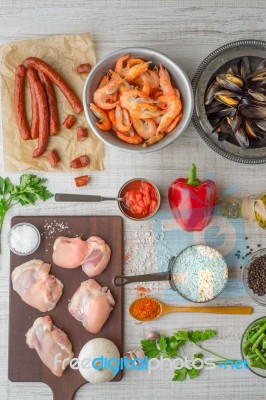 Ingredients For Paella On The White  Table Vertical Stock Photo