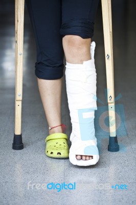Injured Person With Crutches Stock Photo