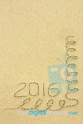 Inscription 2016 And Streamers In The Sand On The Beach Stock Photo