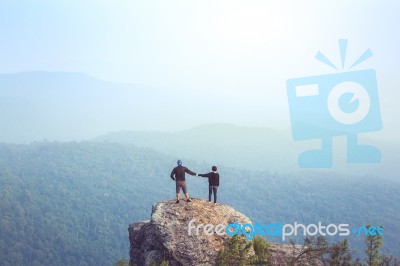 Instagram Filter Young Man Asia Tourist At Mountain Is Watching Over The Misty And Foggy Morning Sunrise, Travel Trekking Stock Photo